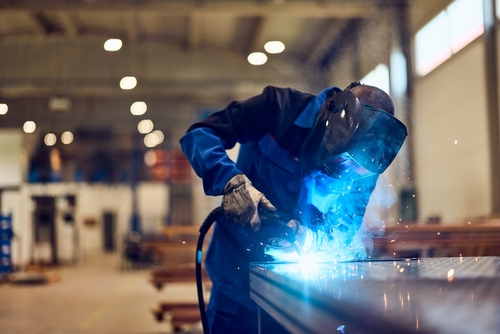 Person,Engaged,In,Welding,Metal,In,An,Industrial,Setting,With